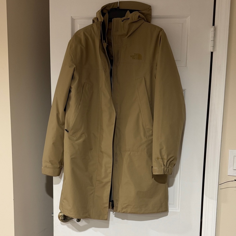 The North Face women’s Beige Raincoat with puffer